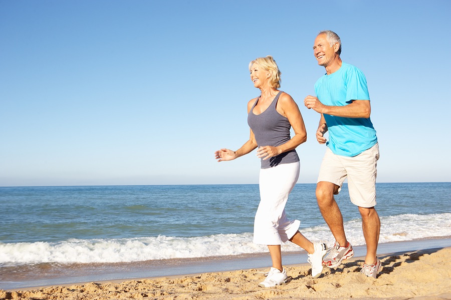 couple jogging on beach
